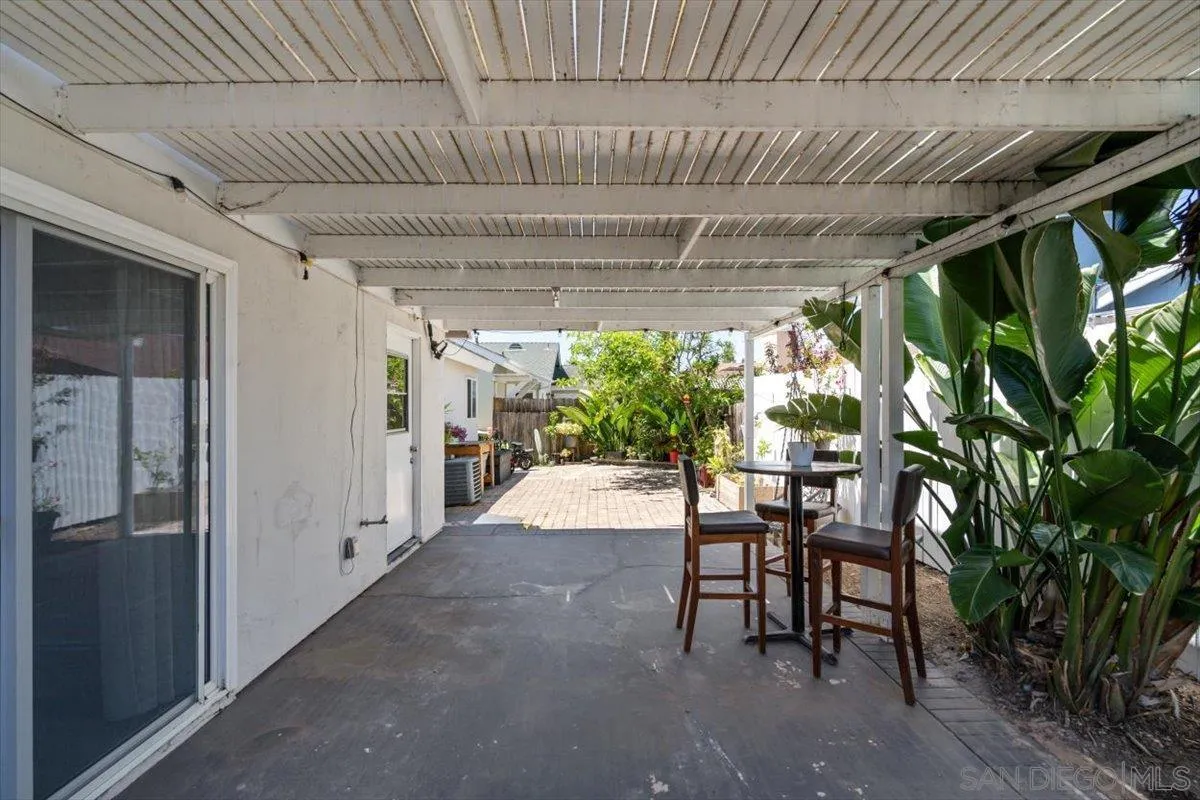2019 Bridgeport Chula Vista, CA 91913 - Photo 21 of 32 a patio with table and chairs and potted plants