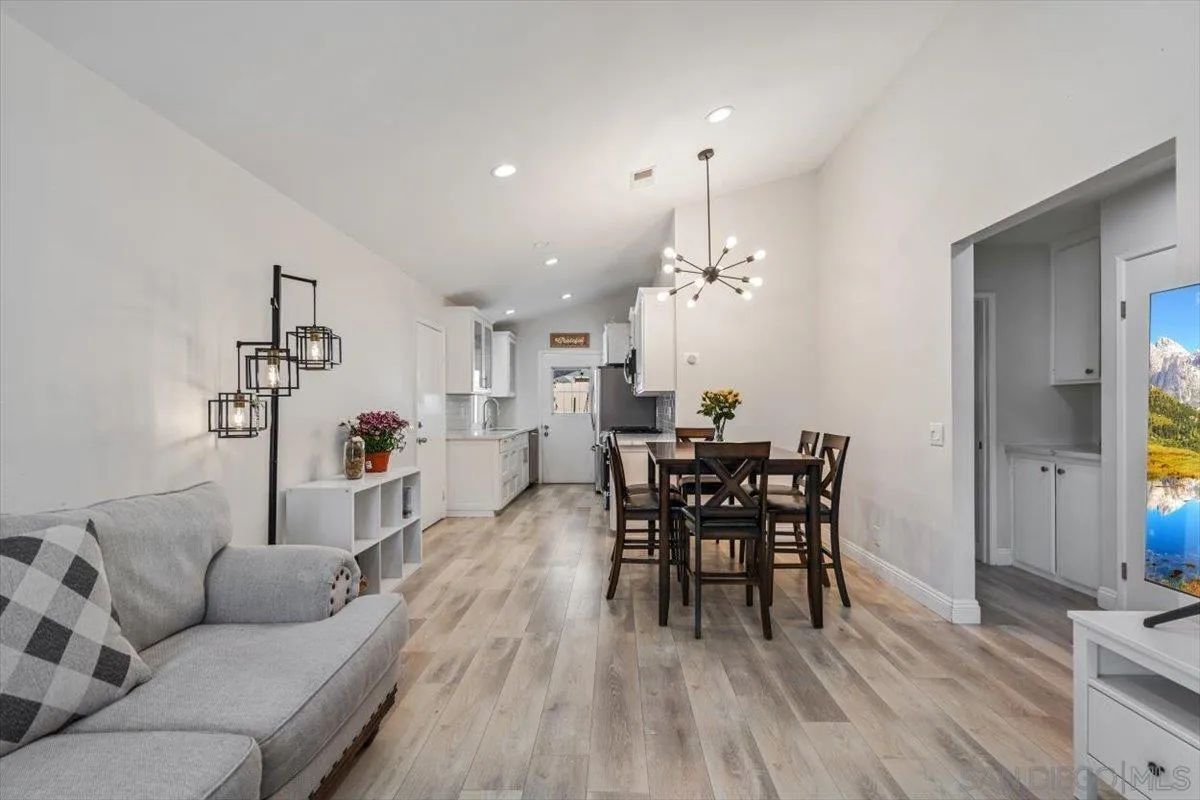 2019 Bridgeport Chula Vista, CA 91913 - Photo 3 of 32 a living room with furniture a dining table and a potted plant