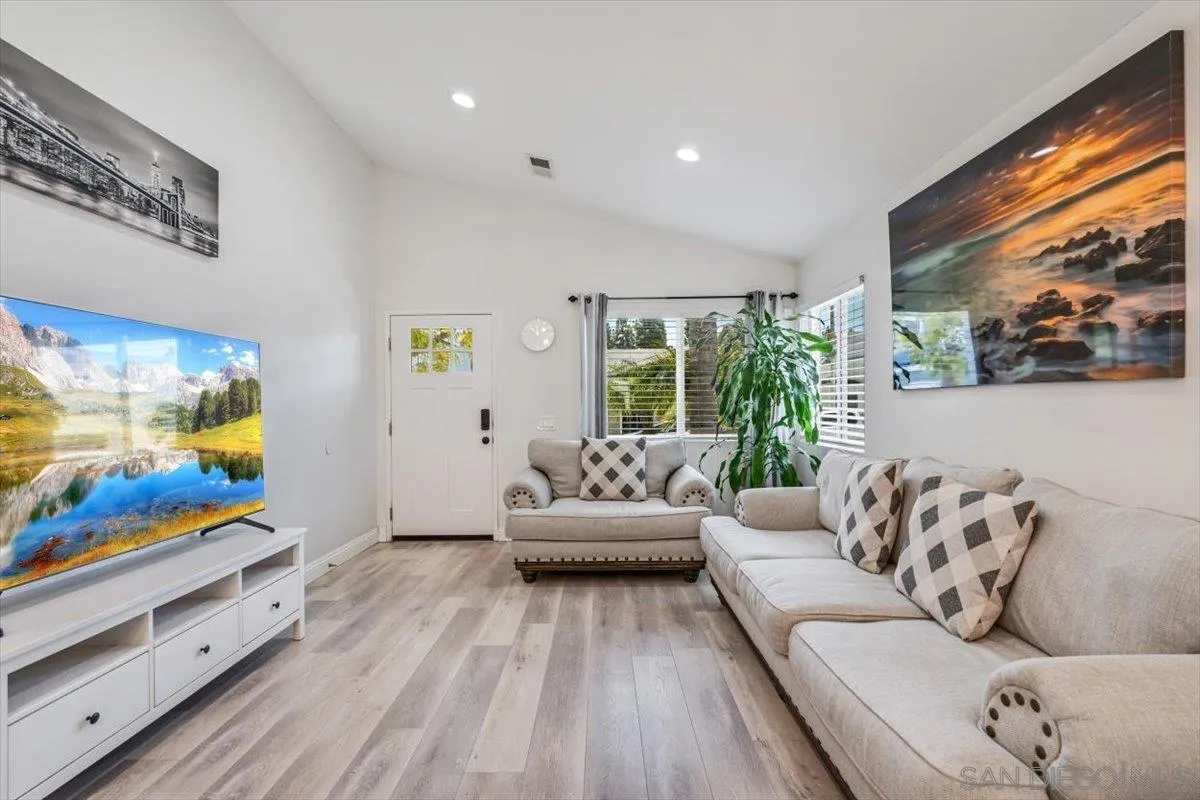 2019 Bridgeport Chula Vista, CA 91913 - Photo 4 of 32 a living room with furniture and flat screen tv