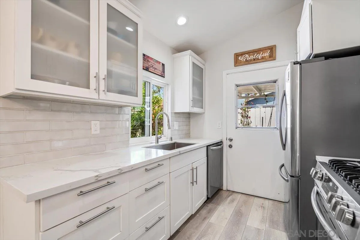 2019 Bridgeport Chula Vista, CA 91913 - Photo 9 of 32 a view of a kitchen with fridge and sink