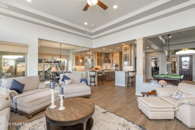 a bathroom with a sink double vanity granite tub shower and a mirror