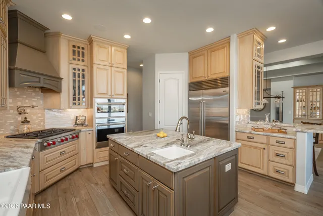 a workspace with wooden floor and a window