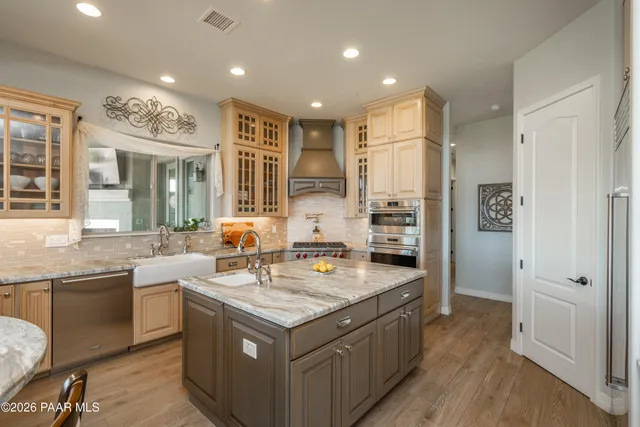 a workspace with chandelier fan