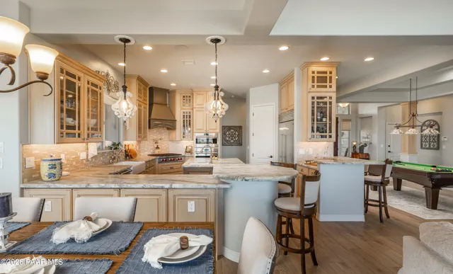 a view of a livingroom with a bookshelf and a chair