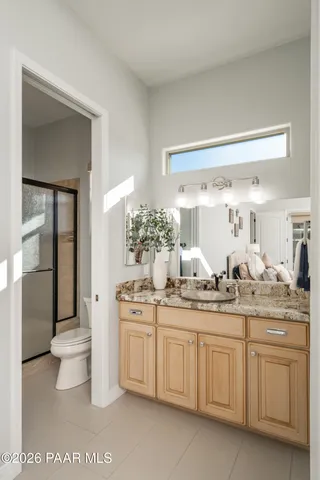 a view of living room filled with furniture and city view