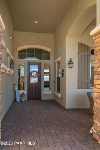 a kitchen with granite countertop kitchen island wooden cabinets and stainless steel appliances