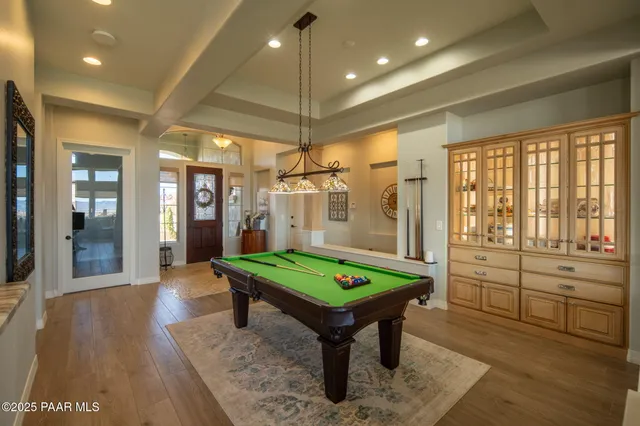 a large kitchen with a table and chairs