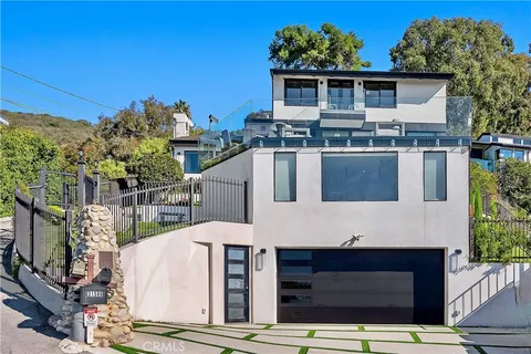 a front view of a house with a garage