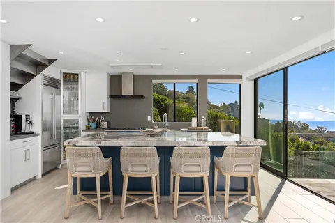 a kitchen with a table and chairs