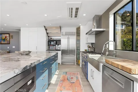 a kitchen with a table and chairs