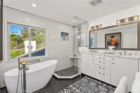 a bathroom with a bathtub sink and toilet