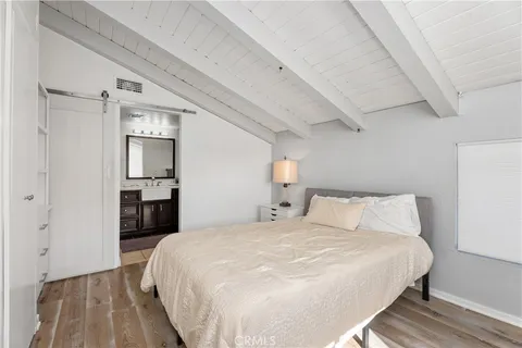 a large white bed in a white room