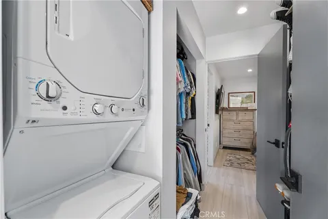 a en suite bathroom with a sink double vanity granite tub and shower