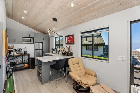 a living room with furniture a window and a table