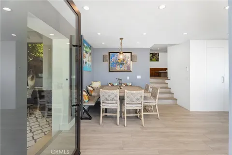 a dining room with a table and chairs