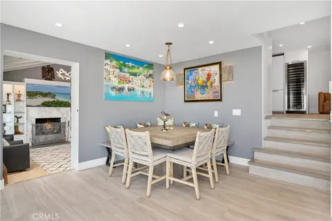 a view of a dining room with furniture wooden floor and chandelier