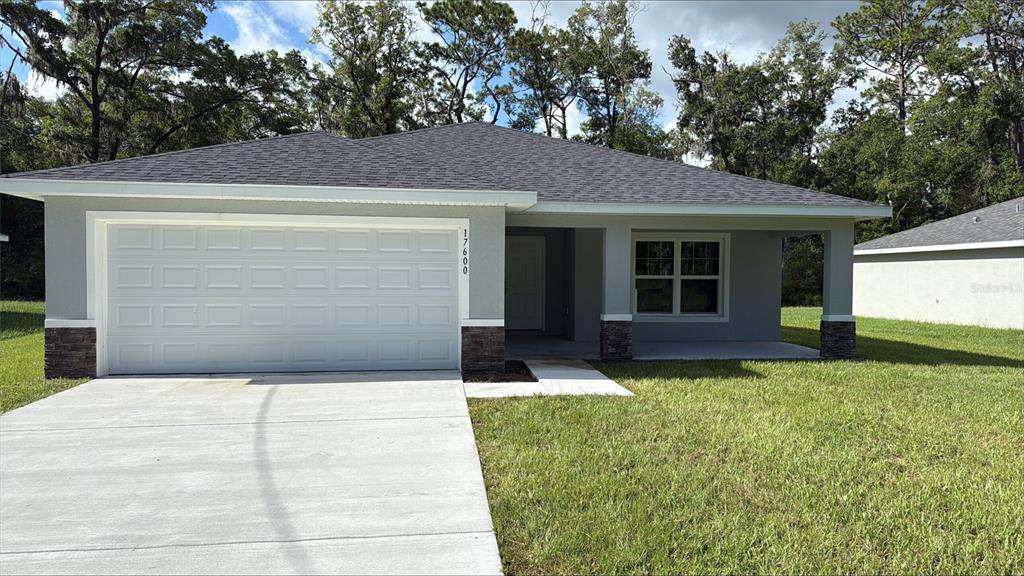 17600 Southwest 113th Place Dunnellon, FL 34432 - Photo 2 of 33 a front view of house with yard