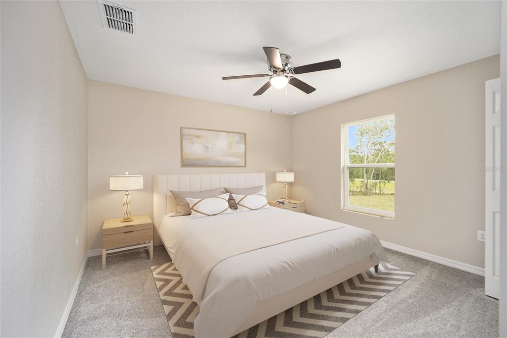 17600 Southwest 113th Place Dunnellon, FL 34432 - Photo 21 of 33 a bedroom with a bed and a window