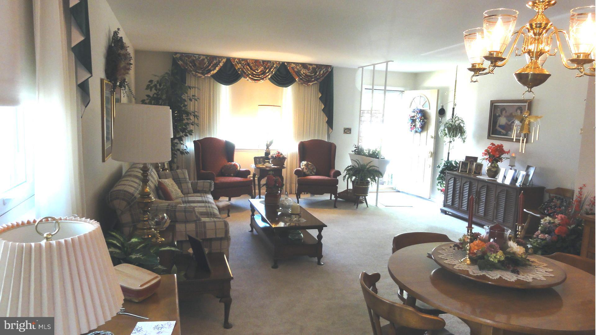 3726 Collier Road Randallstown, MD 21133 - Photo 2 of 20 a living room with furniture and a large window