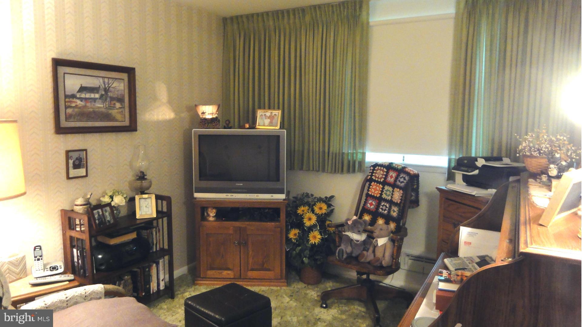 3726 Collier Road Randallstown, MD 21133 - Photo 11 of 20 a room with furniture and flat screen tv
