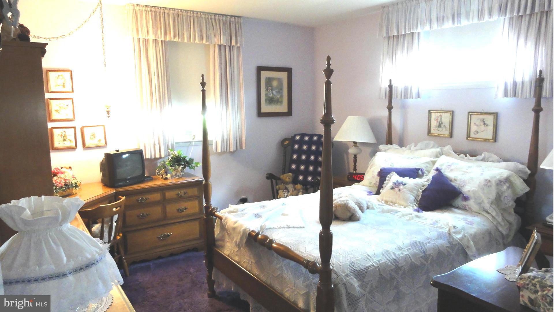 3726 Collier Road Randallstown, MD 21133 - Photo 8 of 20 a bedroom with a bed and wooden floor
