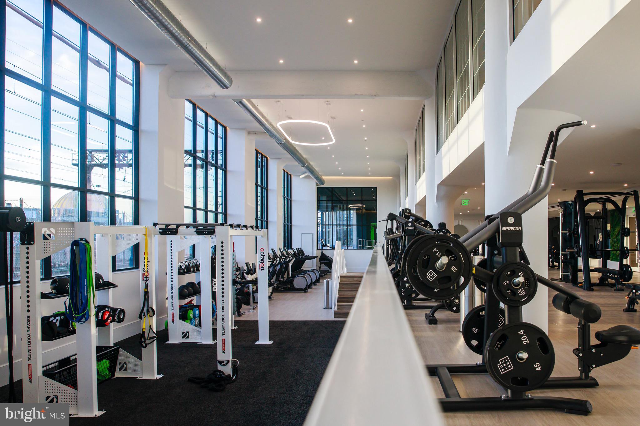 900 North 9th Street Philadelphia, PA 19123 - Photo 14 of 30 a very nice looking living room with lots of gym equipment