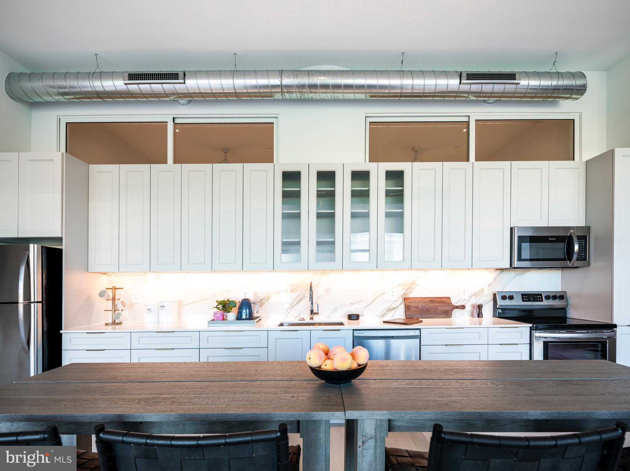 900 North 9th Street Philadelphia, PA 19123 - Photo 2 of 30 a kitchen with a sink a stove and cabinets