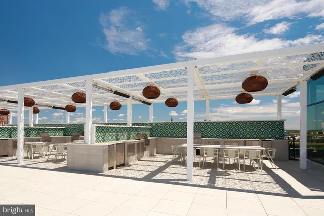 a view of swimming pool with sitting area