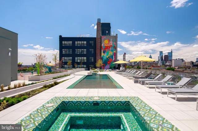 a swimming pool with outdoor seating and yard