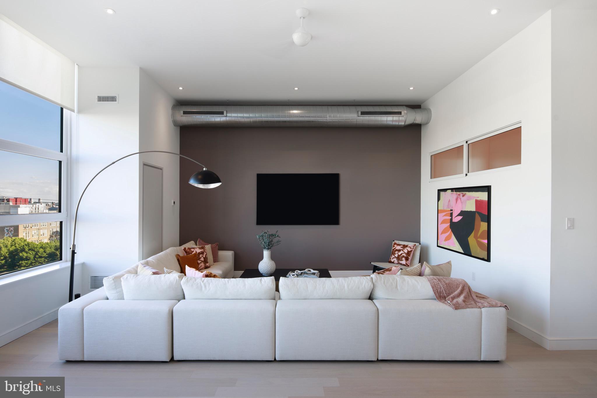 900 North 9th Street Philadelphia, PA 19123 - Photo 6 of 30 a living room with furniture and a flat screen tv