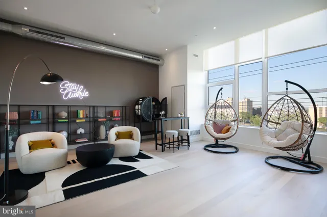 a view of living room with furniture and chandelier