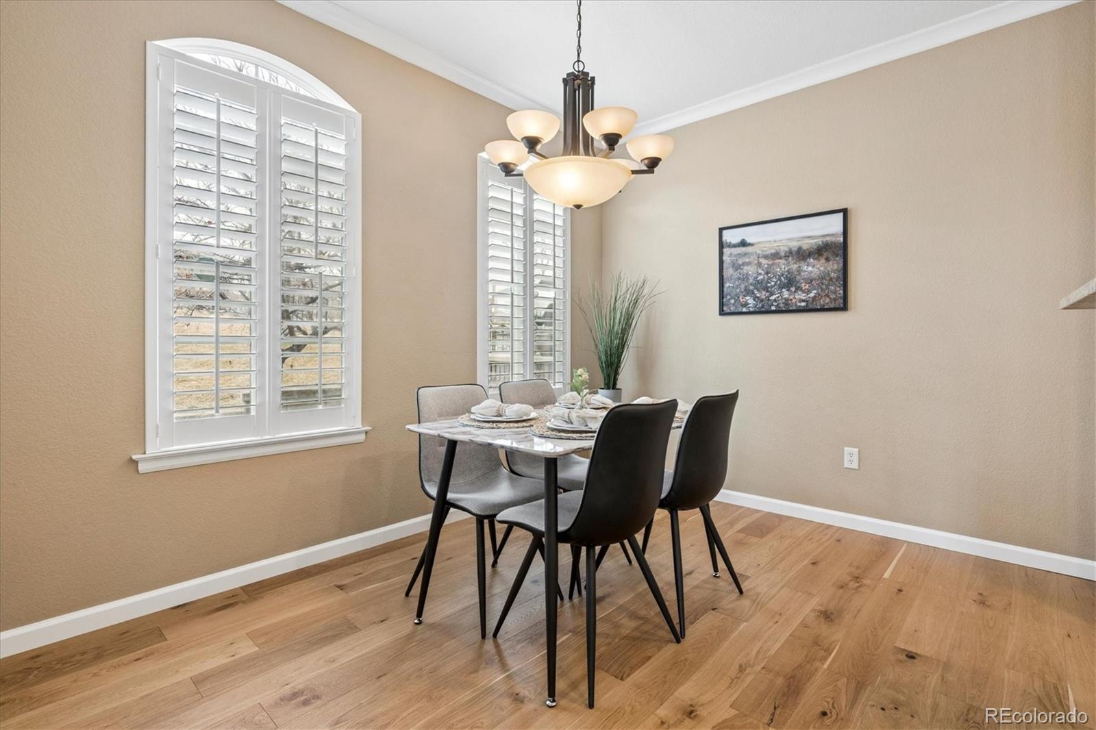 485 Elmhurst Way, Unit C Highlands Ranch, CO 80129 - Photo 16 of 42 a view of a dining room with furniture and wooden floor