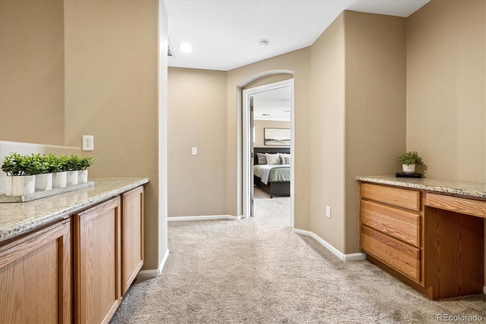 485 Elmhurst Way, Unit C Highlands Ranch, CO 80129 - Photo 28 of 42 a view of hallway with wooden floor