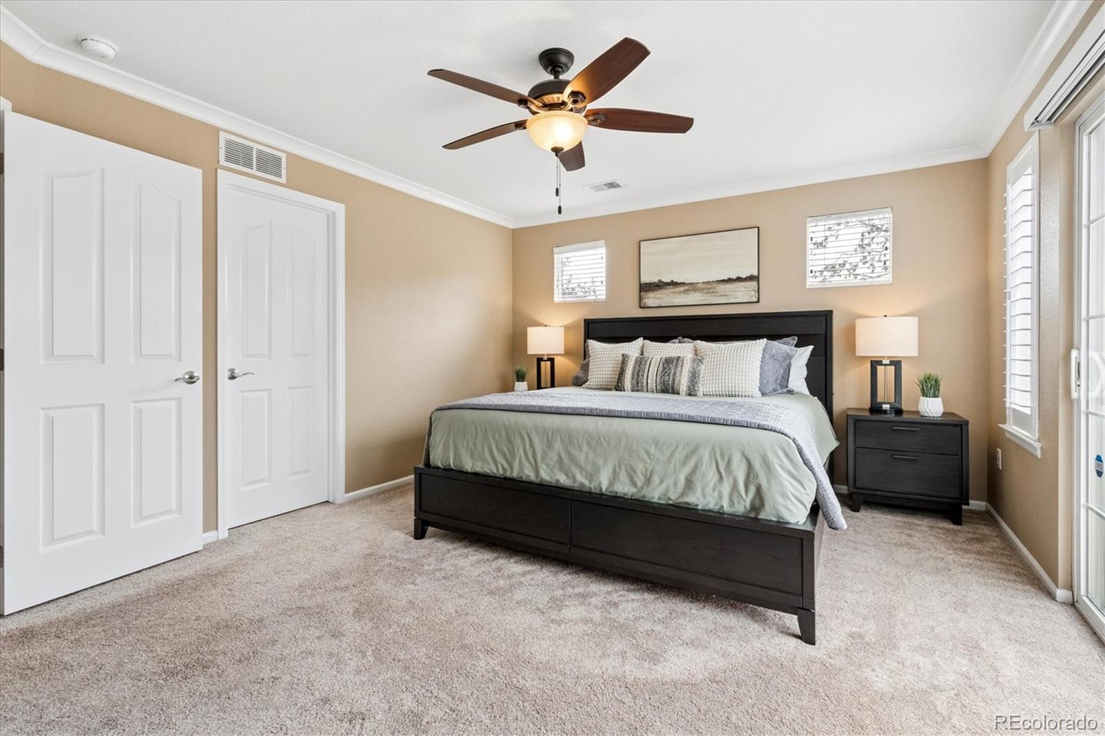 485 Elmhurst Way, Unit C Highlands Ranch, CO 80129 - Photo 31 of 42 a bedroom with a bed and window