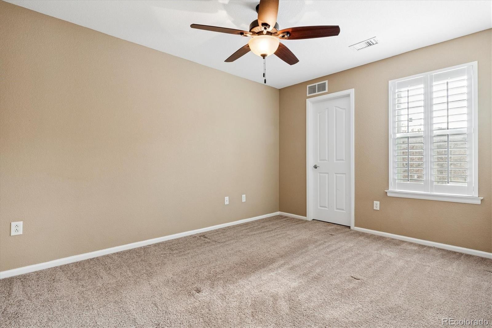 485 Elmhurst Way, Unit C Highlands Ranch, CO 80129 - Photo 36 of 42 a view of an empty room with a window