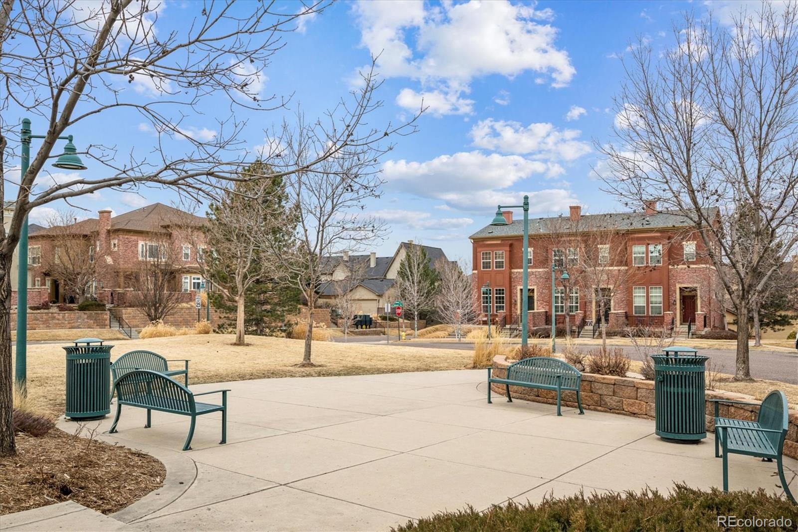 485 Elmhurst Way, Unit C Highlands Ranch, CO 80129 - Photo 42 of 42 a view of a building with yard and sitting area