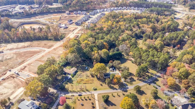a view of aerial view of residential houses with yard