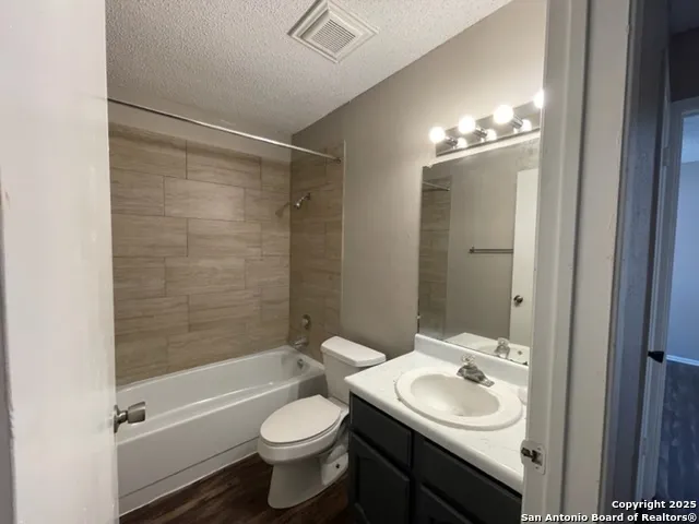 a bathroom with a sink toilet tub and shower