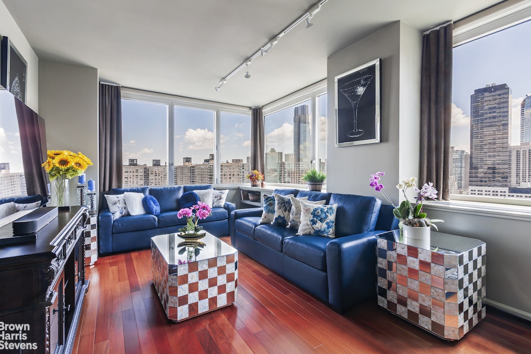 100 Riverside Boulevard, Unit 27A Manhattan, NY 10069 - Photo 1 of 48 a living room with furniture and floor to ceiling windows