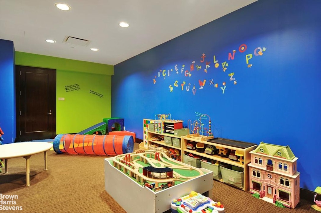 100 Riverside Boulevard, Unit 27A Manhattan, NY 10069 - Photo 14 of 48 a bedroom with furniture and a small yard