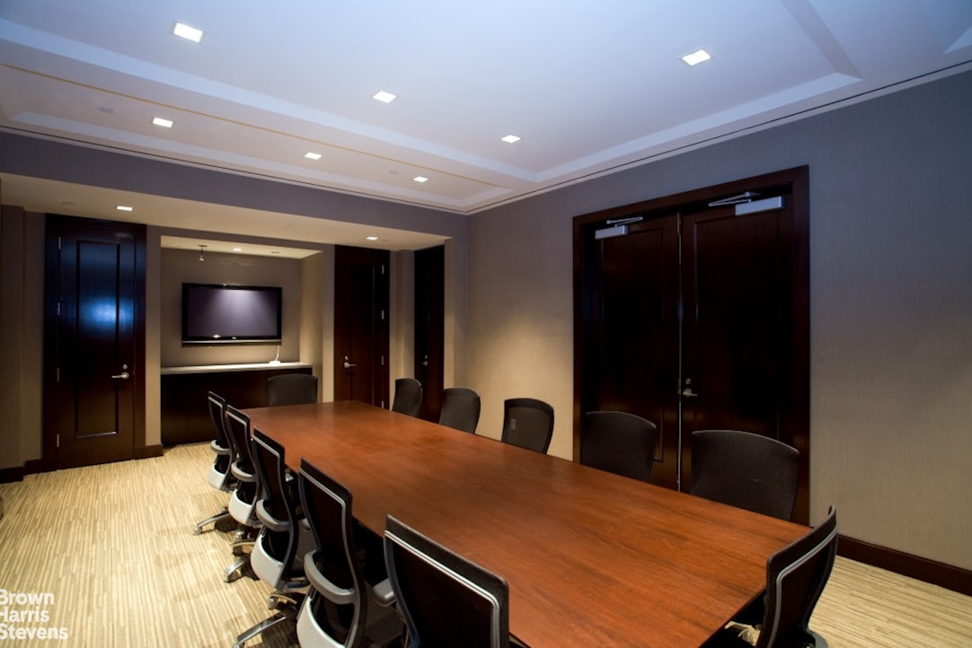 100 Riverside Boulevard, Unit 27A Manhattan, NY 10069 - Photo 16 of 48 a room with furniture and a flat screen tv