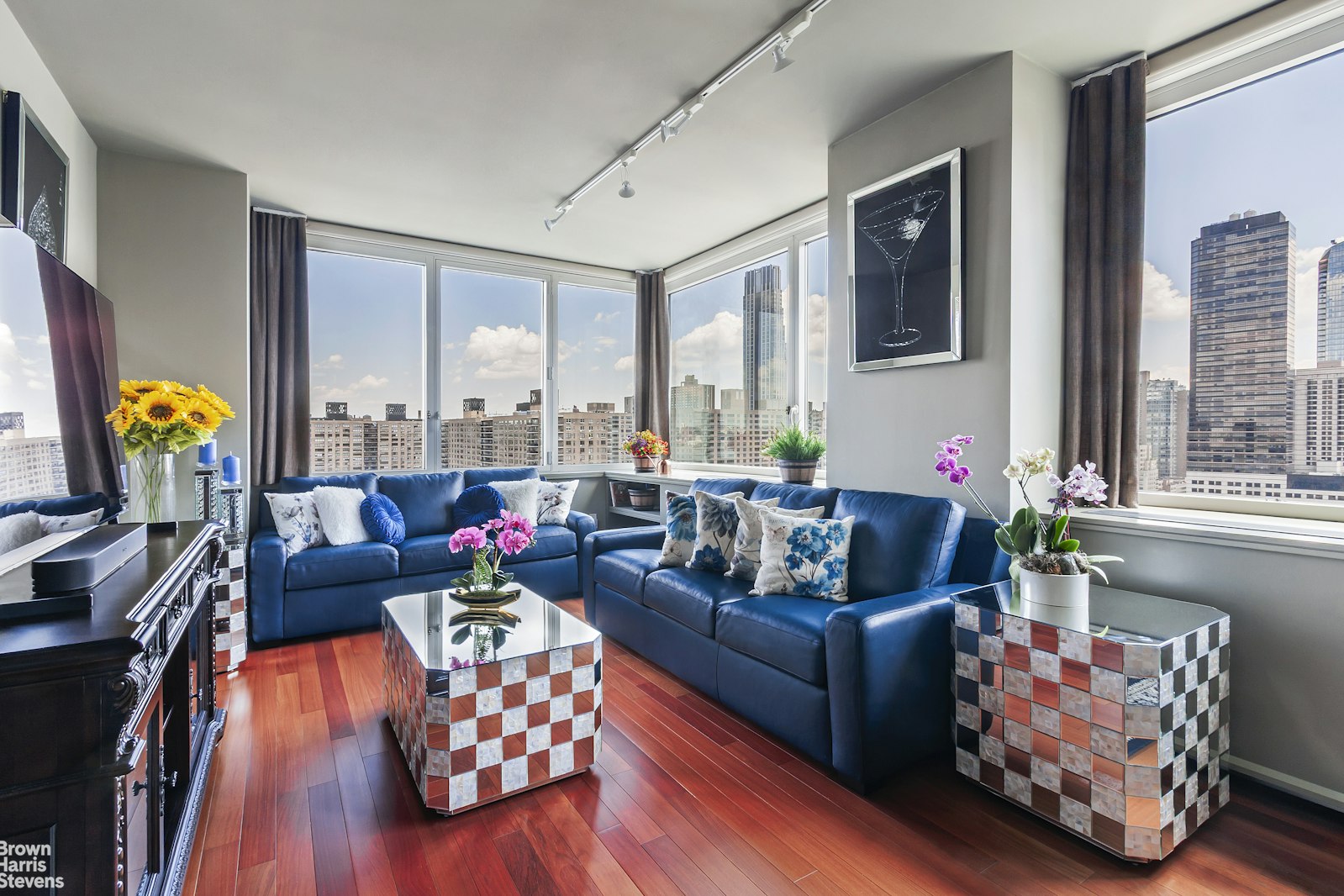 100 Riverside Boulevard, Unit 27A Manhattan, NY 10069 - Photo 24 of 48 a living room with furniture and floor to ceiling windows