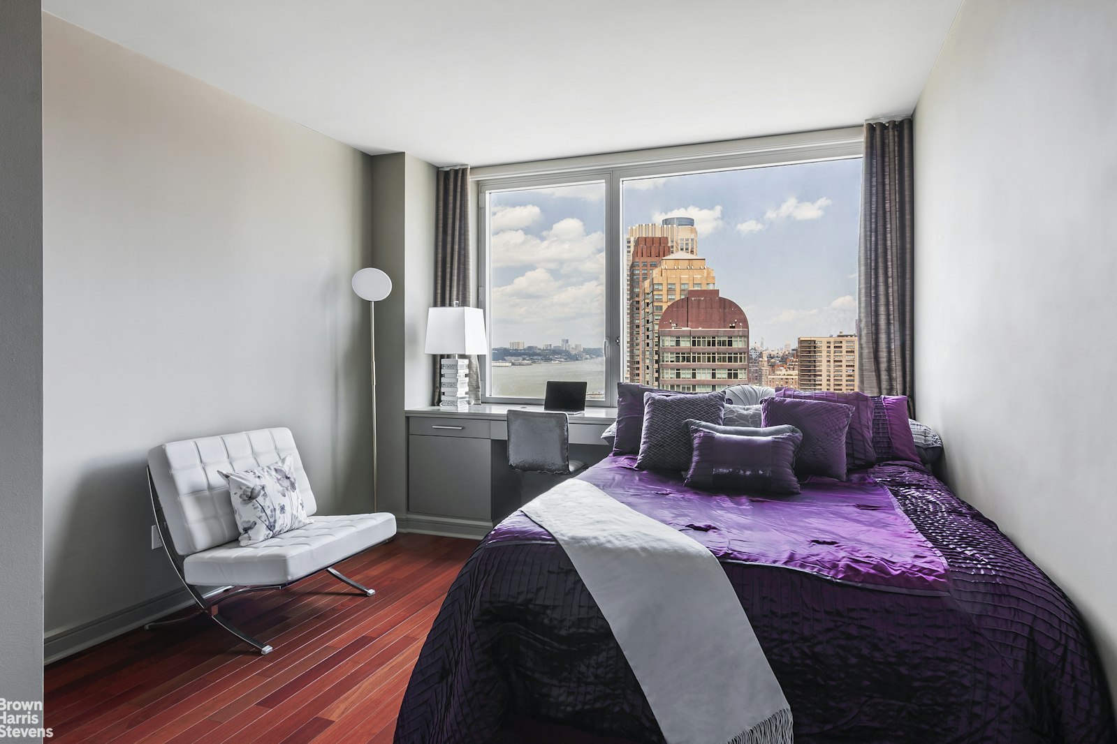 100 Riverside Boulevard, Unit 27A Manhattan, NY 10069 - Photo 28 of 48 a bed sitting in a bedroom next to a window