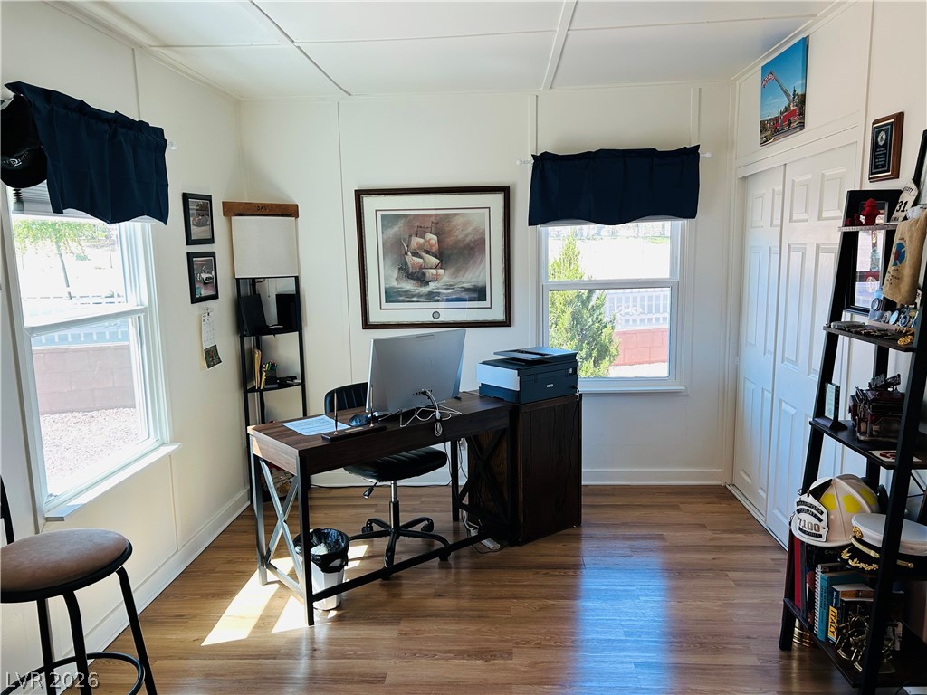 116 West Basic Road Henderson, NV 89015 - Photo 16 of 39 A well-lit study with durable hardwood flooring and generous natural light from multiple windows.