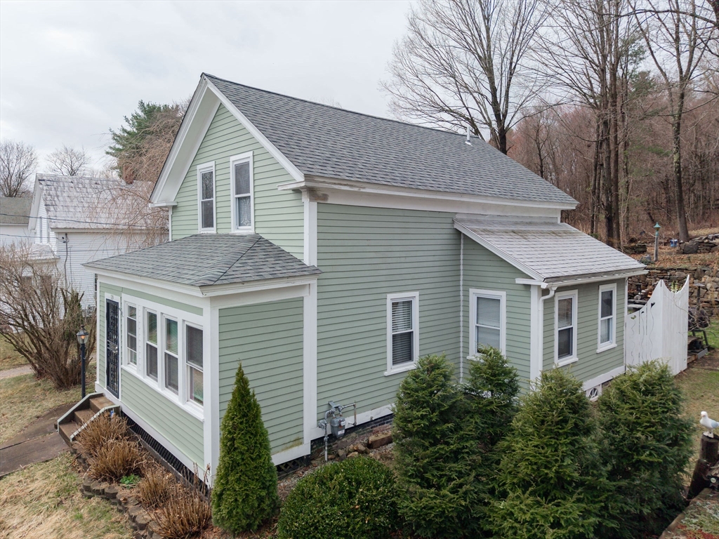 129 School Street Warren, MA 01083 - Photo 2 of 41 a front view of a house with a yard