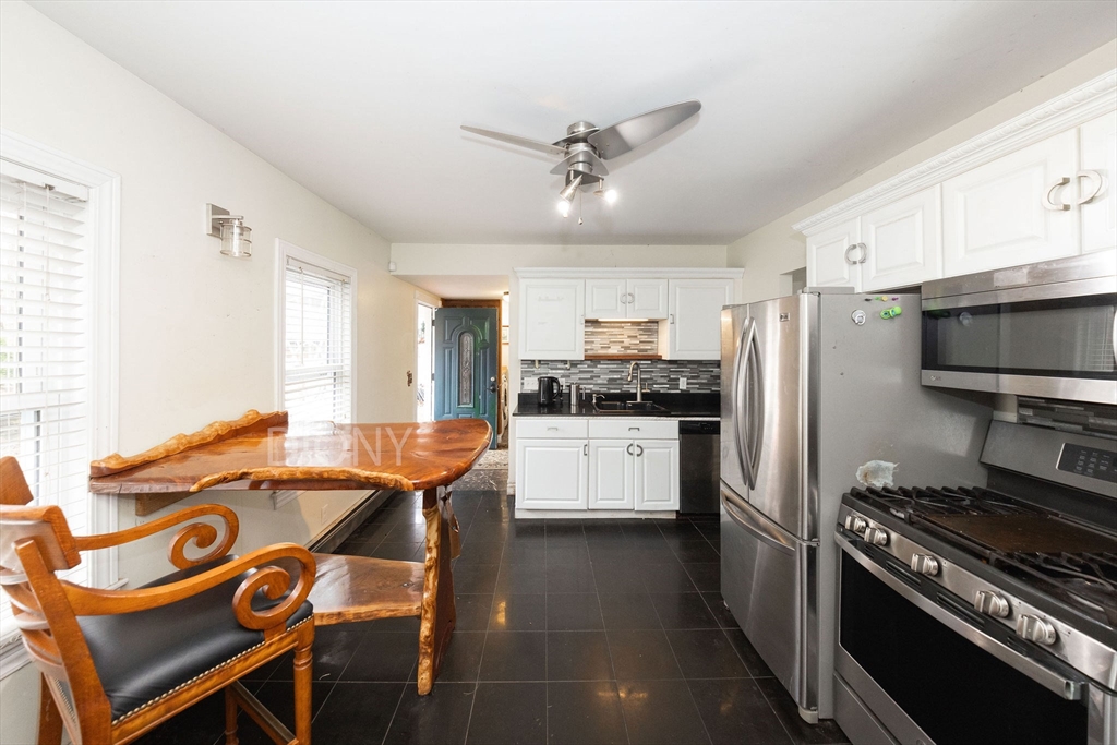 129 School Street Warren, MA 01083 - Photo 21 of 41 a kitchen with stainless steel appliances granite countertop a sink stove and refrigerator