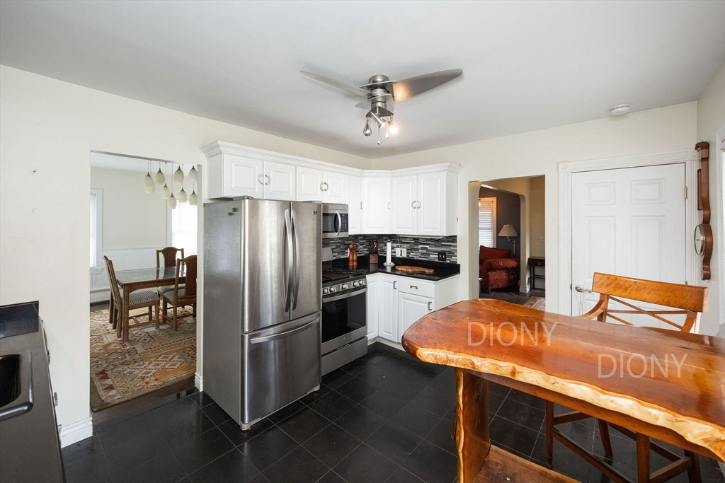 129 School Street Warren, MA 01083 - Photo 25 of 41 a kitchen with stainless steel appliances a refrigerator and a stove top oven