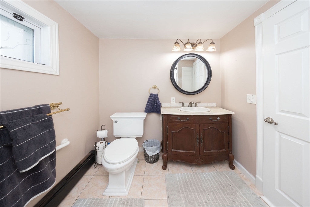 129 School Street Warren, MA 01083 - Photo 30 of 41 a bathroom with a toilet a sink and a mirror