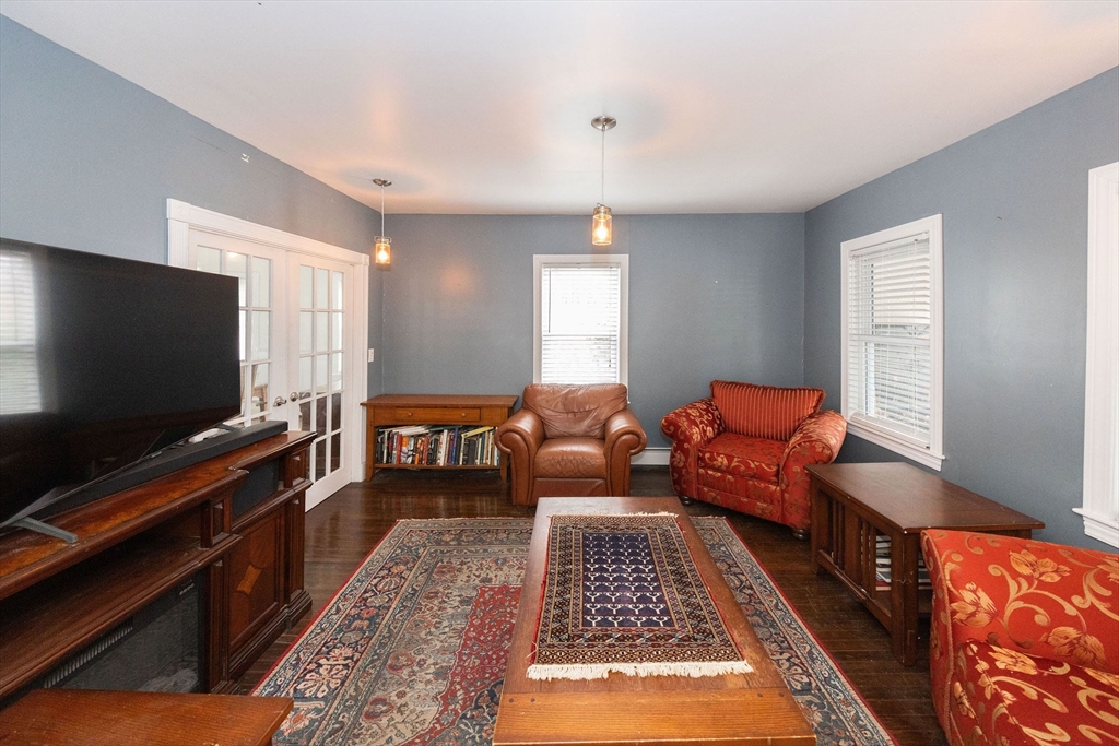 129 School Street Warren, MA 01083 - Photo 32 of 41 a living room with furniture and a flat screen tv