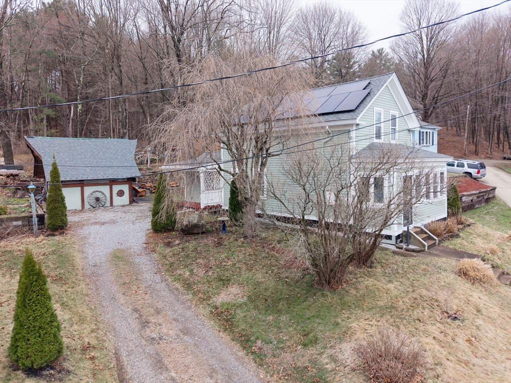 129 School Street Warren, MA 01083 - Photo 5 of 41 a view of a house with a yard and wooden fence